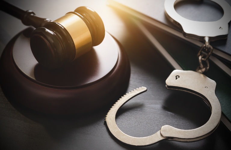 Handcuffs and judge's gavel